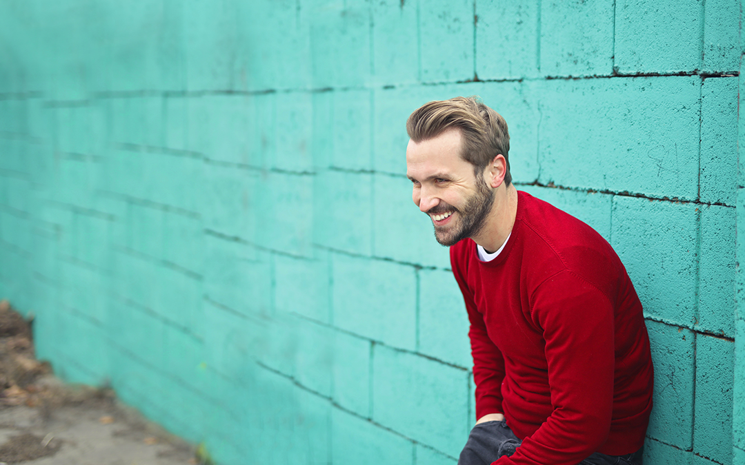 Coping Skills for Depression, Man smiling leaning against wall