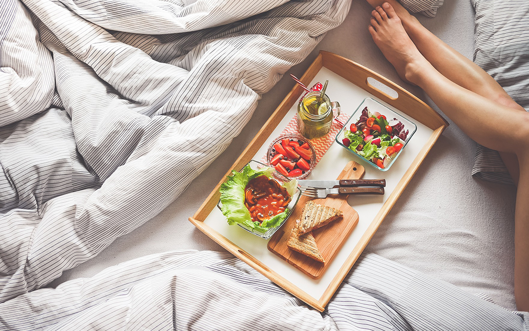 Foods to Increase Sex Drive, Woman's legs on bed with food on tray