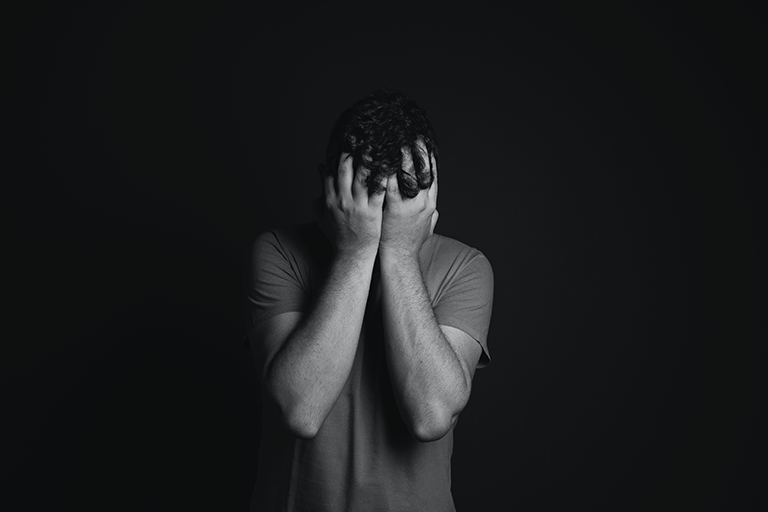 Depression Stress Anxiety Test, image of a guy with his hands covering face