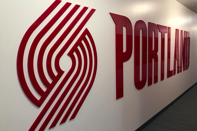 Traveling With the NBA: Helping Players Reach Peak Performance, image of the Portland Trail Blazers Logo on a walll