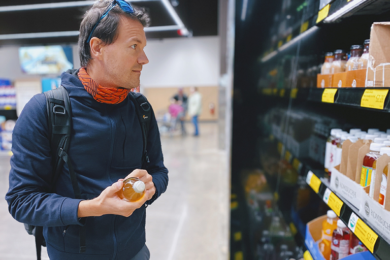 16 Cancer Causing Foods, image of a man shopping for food