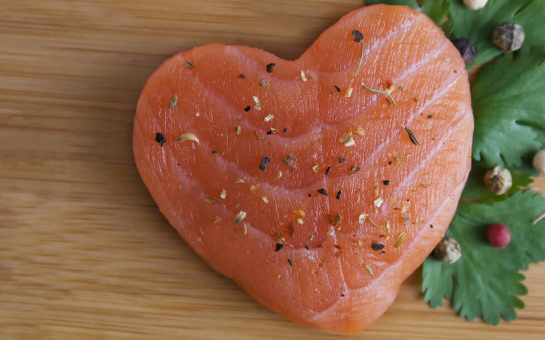 Top 5 Foods for Heart Attack and Stroke Prevention, image of a heart shaped Salmon on a cutting board