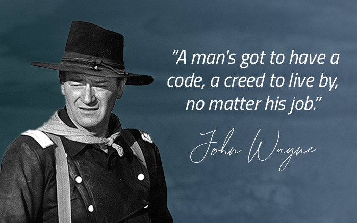 What Does It Mean For A Man To Be Stoic?, image of John Wayne with quote "A man's got to have a code, a creed to live by, no matter his job."